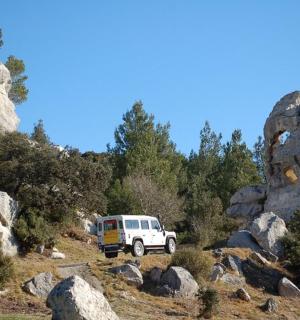 a white van parked on the side of a mountain