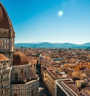 an aerial view of a city with a building