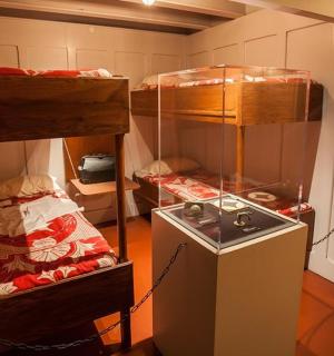a small room with two bunk beds in it