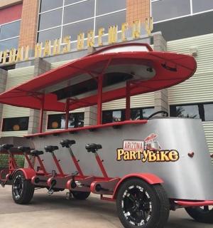 a picnic bike trailer parked in front of a building