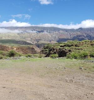 a view of a mountain from the top of a hill