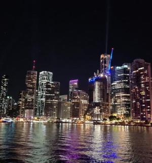 a view of a city at night with the water