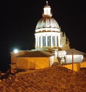 a building with a tower on top of it at night