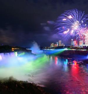 a firework display over the niagara falls at night
