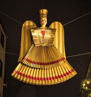 a large yellow dress hanging from a string