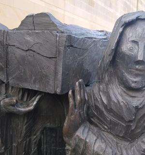 a statue of a person wearing a outfit