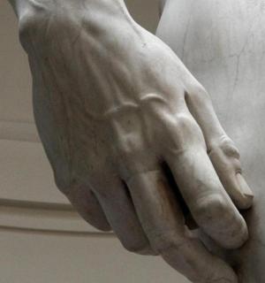 a statue of a hand on a wall