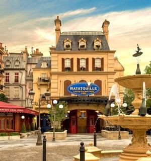 a large building with a fountain in front of it