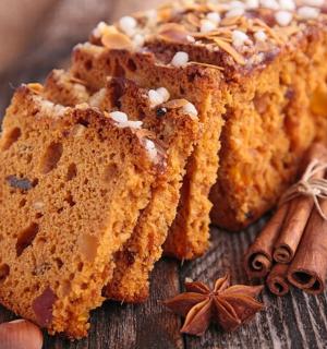a loaf of bread with nuts and spices on a table