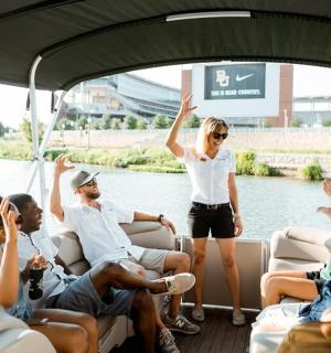 a woman on a boat with a group of people