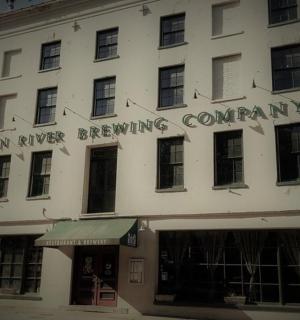 a building with a sign that reads moon river brewing company