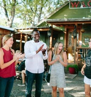 a group of people standing in front of a building
