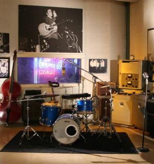 a music room with a lot of instruments in it