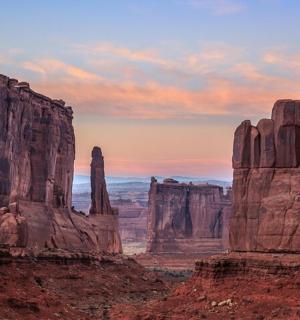 a view of a desert canyon at sunset