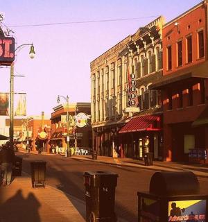 a city street with people walking down the street