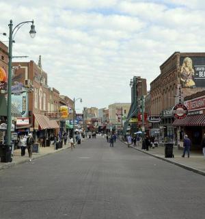 a city street with people walking down the street