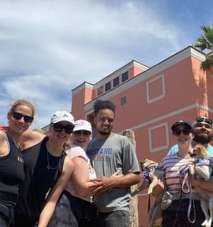 a group of people standing in front of a building