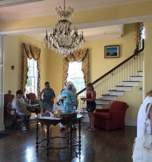 a group of people standing in a living room