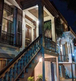a building with a staircase on the side of it at night