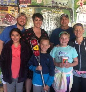 a group of people posing for a picture in a room