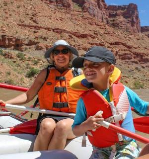 a group of people on a boat in the river