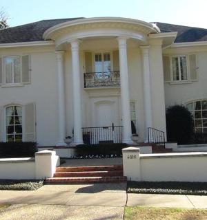 a large white house with a porch and columns