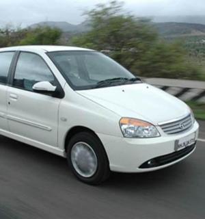 a white car is driving down a highway