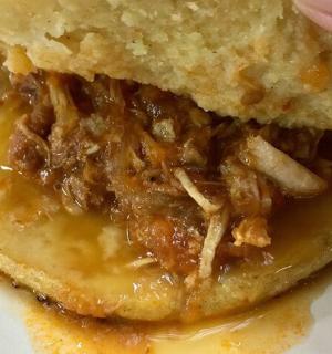 a sandwich with meat and cheese on a plate