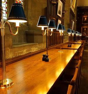 a long table in a room with lights on it