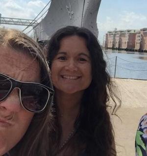 three women are standing next to each other