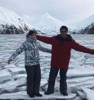 a man and a woman standing on melting ice