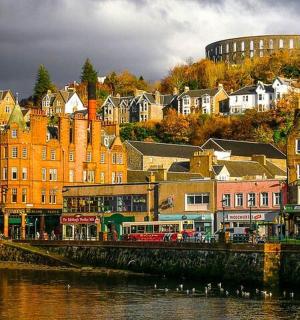 a group of buildings next to a body of water