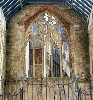a large window in a building with a fence