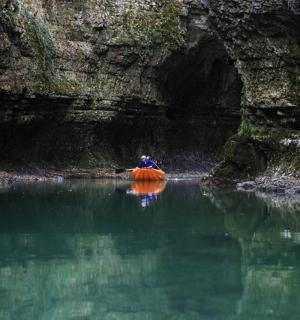 a person in a kayak in a body of water