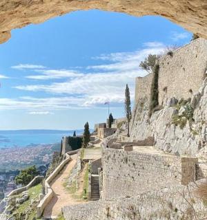 a view from a window of a stone building