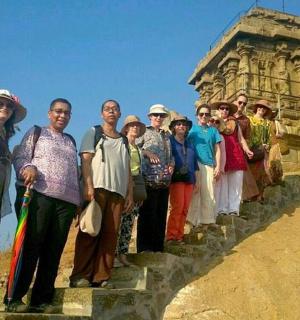 a group of people standing on the steps of a building