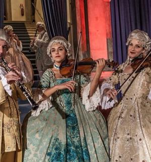 a group of people playing music on a stage