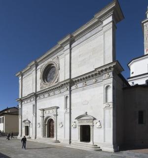 a large white building with a clock tower