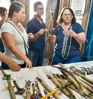 a group of people standing around a table with weapons