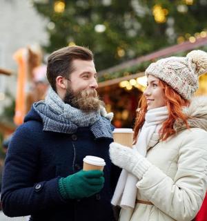 a man and a woman holding a cup of coffee