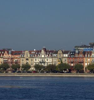 a large building next to a body of water
