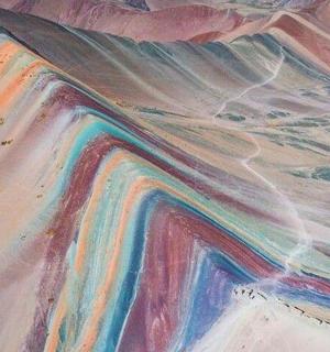 a painting of a desert with rainbow colors