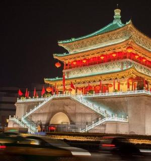 a building with a chinese tower at night