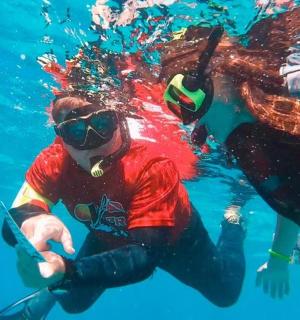a person in the water with a diver