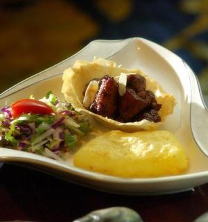 a plate of food with a sandwich and salad