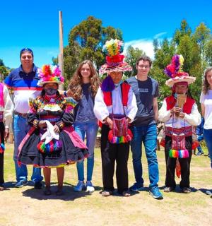 a group of people in traditional clothing posing for a picture