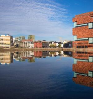 a building with its reflection in a body of water