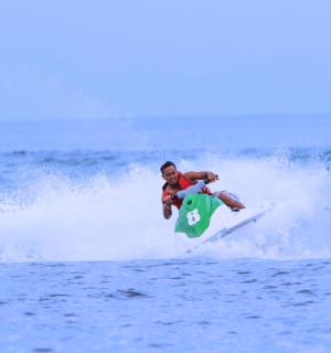 a man riding a wave on a surfboard in the ocean
