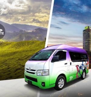 a white and green truck parked in front of a city