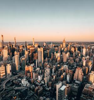 an aerial view of a city with tall buildings